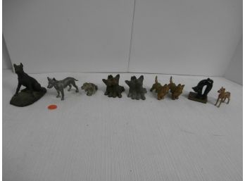9 Figurines Of 8 Dogs And 1 Black Cat On Book