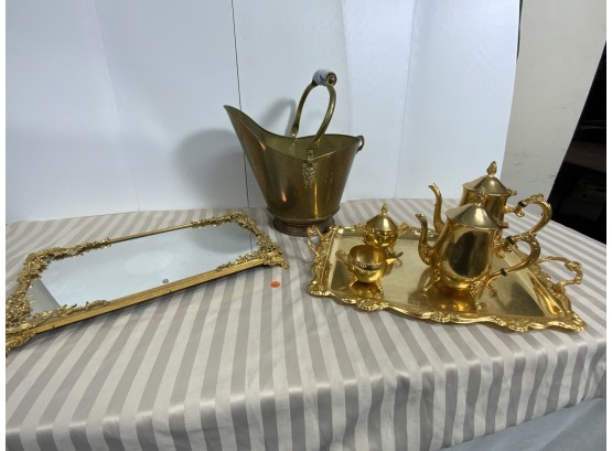 Brass And Gold Colored Lot Including A Tea Set With Serving Platter, A Vanity Mirror And A Coalhog
