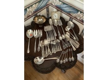 Silver Plate Including Forks, Spoons, Serving Pieces, A Bowl With Ladle An A Clock