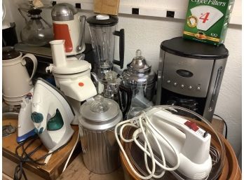 Assorted Lot Of Kitchen Appliances Including Coffee Pots, Irons, Crock Pot, Scale And More