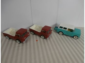 3 Vintage Structo Pressed Steel And Plastic Vehicles Including 2 Red Trucks And 1 Blue Jeep
