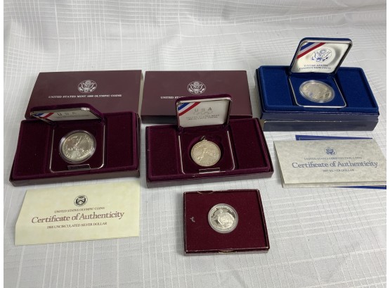 4 Commemorative Silver Dollars And Half Dollar 1982,87,88