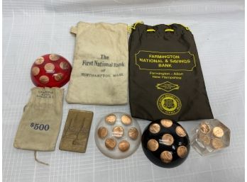 Early Bank Bags, Coin Paperweights, And A Bronze Plaque
