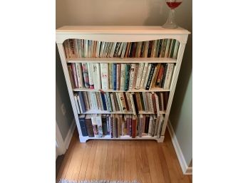 White Bookcase With Assorted Novels And Cooking Books