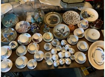 Large Assortment Of China, Collector Plates, Tea Cups, Oil Lamp And More
