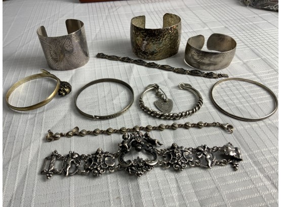 10 Silver Bracelets With A Peruzzi Figural And  Other Cuffs  215.8 Grams