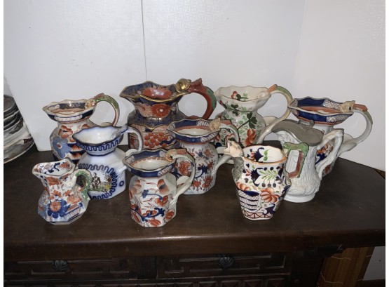 10 Iron Stone Pitchers And Creamers Most With Figural Handles