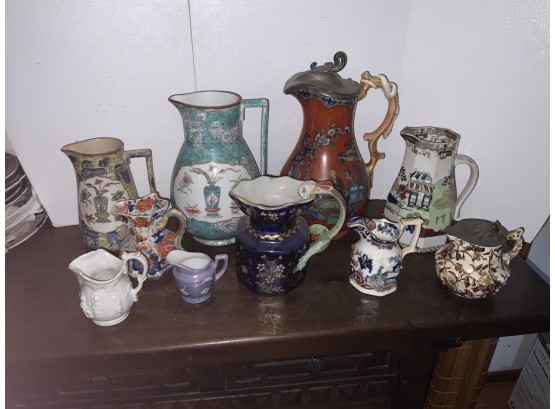 10 Assorted Ironstone And Oriental Creamers And Or Pitchers