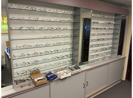 3 Shelves Of Eye Glass Frames All Assorted Sizes And Shapes And Ages