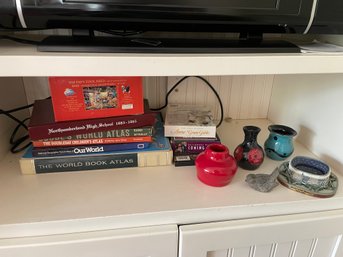 SHELF OF BOOKS, POTTERY, DVDS, YEARBOOK