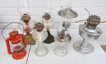 GROUPING OF SEVEN KEROSENE LAMPS AND LANTERNS