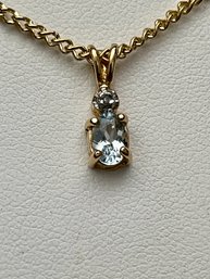 Sterling Silver Gold Plated Blue Topaz And Diamond Chip Pendant With 17' Gold Tone Chain