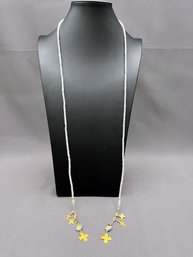 Clear Stone Rondelles And Gold Tone Cross Lariat Necklace 42' Long