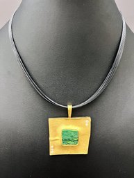18K Geometric Pendant With Diamonds And Natural Green Stone With 5 Small Diamonds Hung On Black Wire Strands