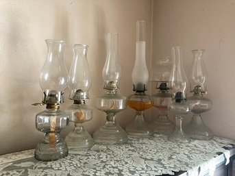 Lot Of Assorted Vintage Clear Oil Lamps With Some Oil Inside