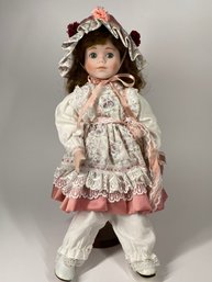 Sweet Porcelain Doll With Bonnet & Ruffled Floral