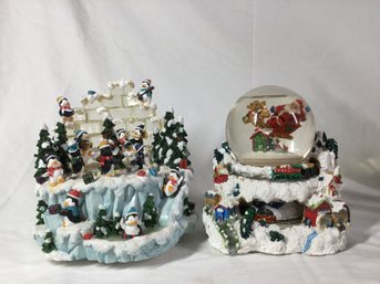 Snow Globe And Playing Penguin Sculpture