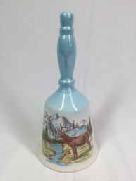 Bell With Elk And Mountains On It