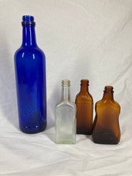 Collection Of Decorative Colored Glass Bottles