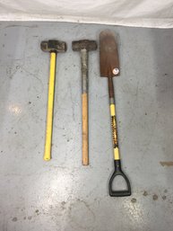 Two Sledge Hammers And A Shovel