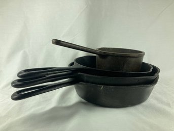 Set Of Cast Iron Pots And Pans