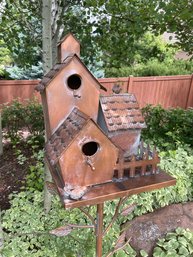 Over 5 Foot Tall Metal Copper Colored Birdhouse From Back Garden