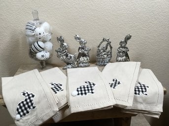 Collection Of Easter Decor Featuring Decorative Towels, Cast Metal Rabbits & Glass Jar Of Eggs