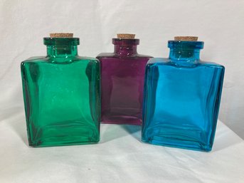 Large Ornate Set Of Colored Glass Bottles