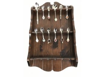 Collection Of Collectible State And City Themed Spoons In Wooden Display