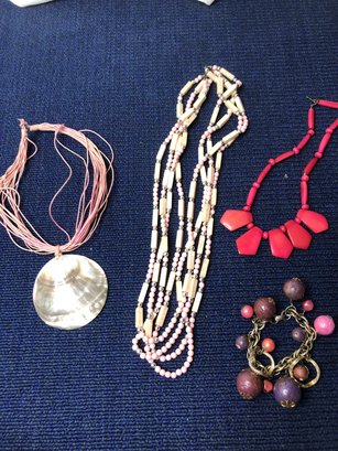 3 Pink Necklaces And A Bracelet