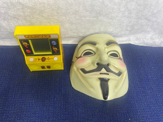 Pac-Man Toy And V For Vendetta Mask