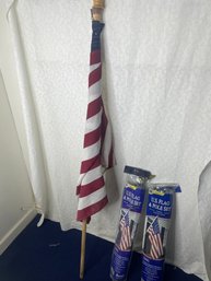 2 Flag Poles And 1 Flag