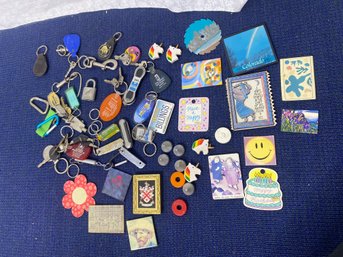 Bundle Of Old Keychains And Magnets