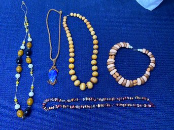 5 Brown/wood Necklaces