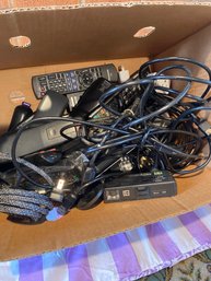 Box Of Remotes And Cables