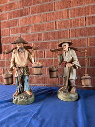 Two Asian Water Carrier Statues