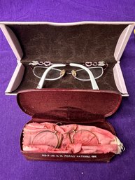 Two Pair Of Glasses And Cases