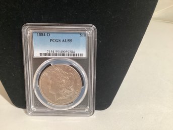 Graded Morgan Silver Dollar 1884-O PCGS MS AU55
