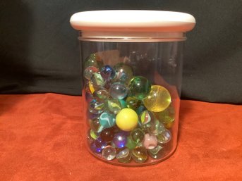 CONTAINER FULL OF MARBLES