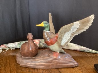 Ceramic Ducks On Log