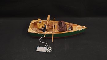 Model Rowboat With Fisherman