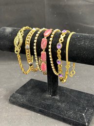 Various Gold Colored Bracelets