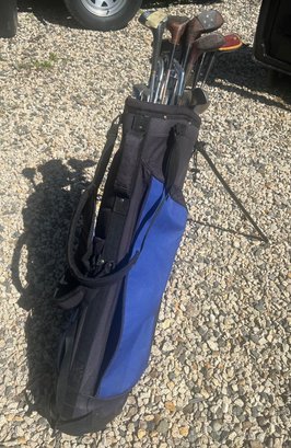 Set Of Golf Clubs In A Blue Bag