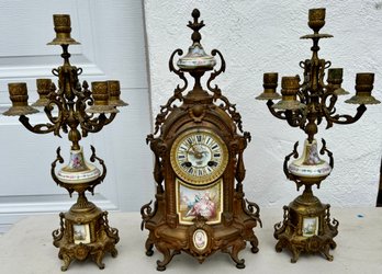 There Piece French Porcelain And Ormolu Mantle Clock Set With Matching Candleabras