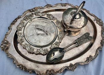 Lot Of Silver Plate Incl A Large Oval Serving Tray, A Circular Serving Tray, A Hotel Plate Teapot, 2 Spoons