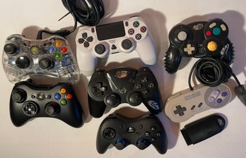 7 Video Game Controllers - See Pics.