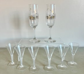 2- 2000 Champagne Glasses, And 6 Cordial Glasses