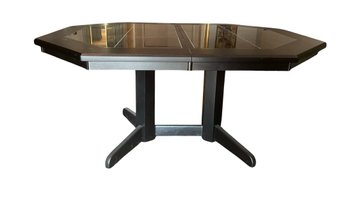 Black Table With Tile Top With Extra Left Under The Table.