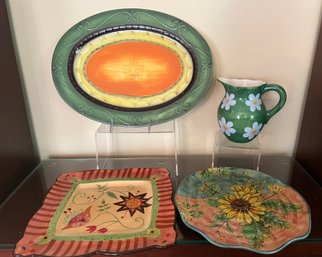 Colorful Trays/platters, And A Green Pitcher With Daisies