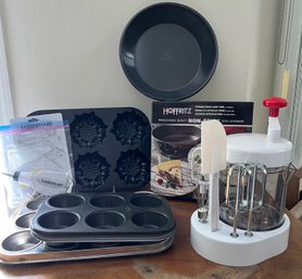 Baking Lot: Weought Iron Daisies Cake Pan, Cupcake Pans, Quick Mixer, Ans Springfoam Pans